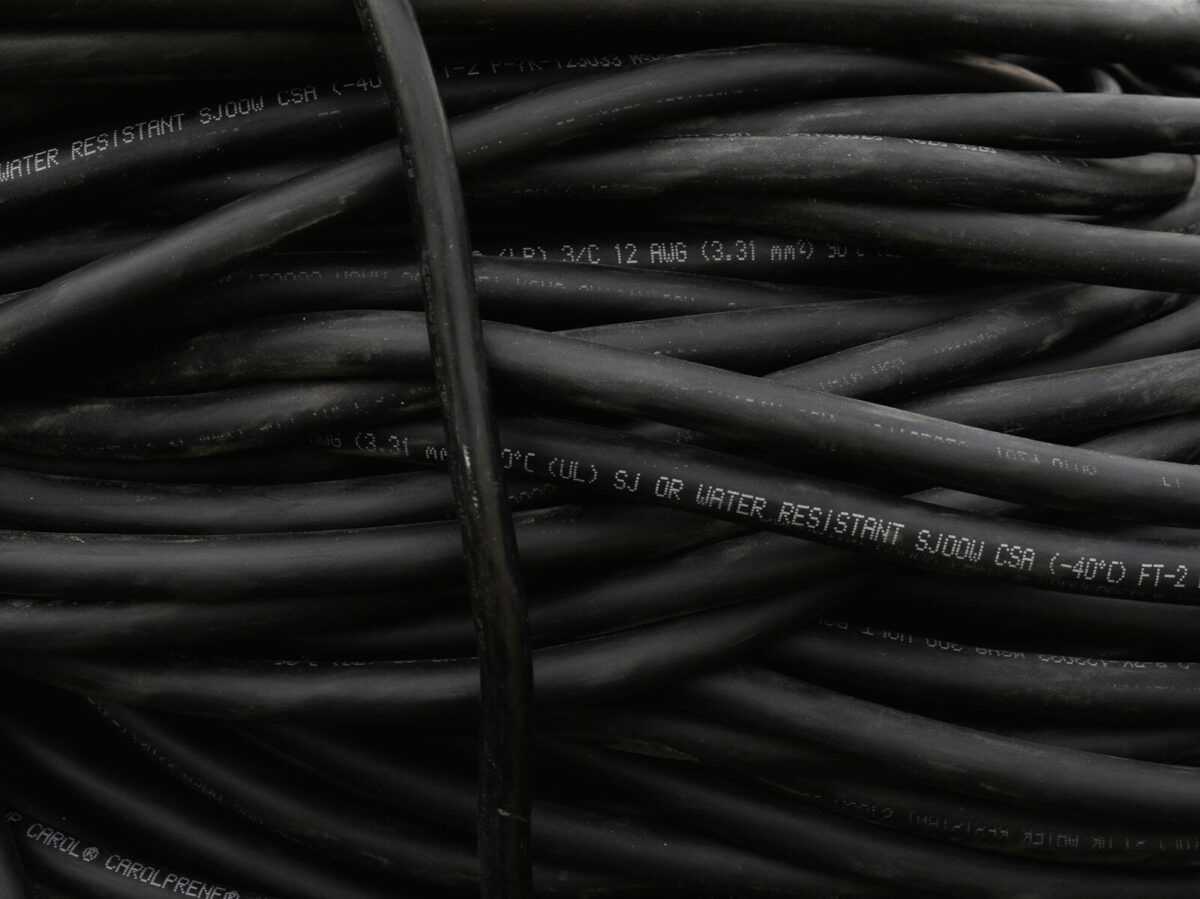 a bunch of black wires are stacked together